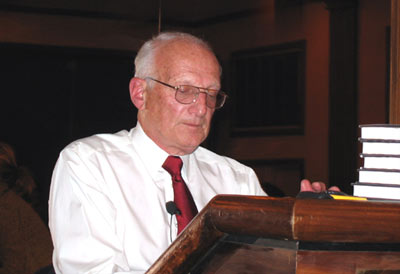 George Ross signing copies of his book at a Learning Annex event in San Diego